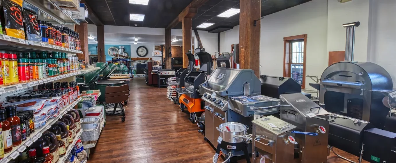 Grill and seasoning display inside Coalway of Charm showroom.